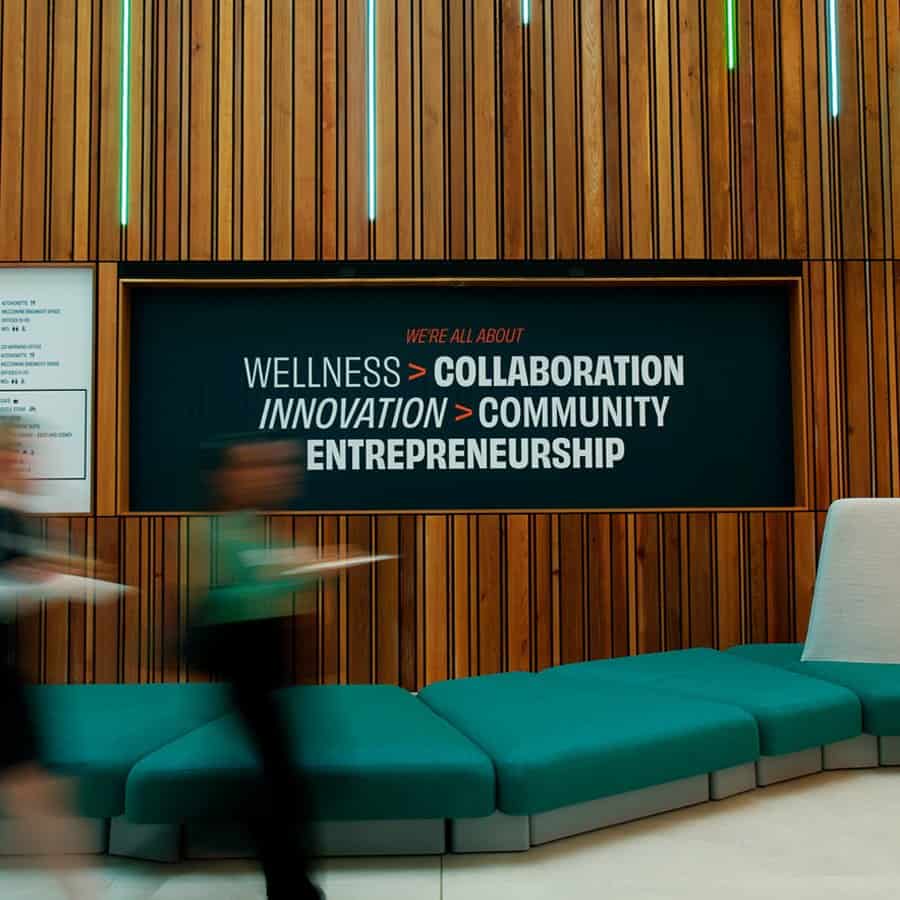 Wellness, collaboration, innovation, community, entrepreneurship displayed on digital screen in mode.
