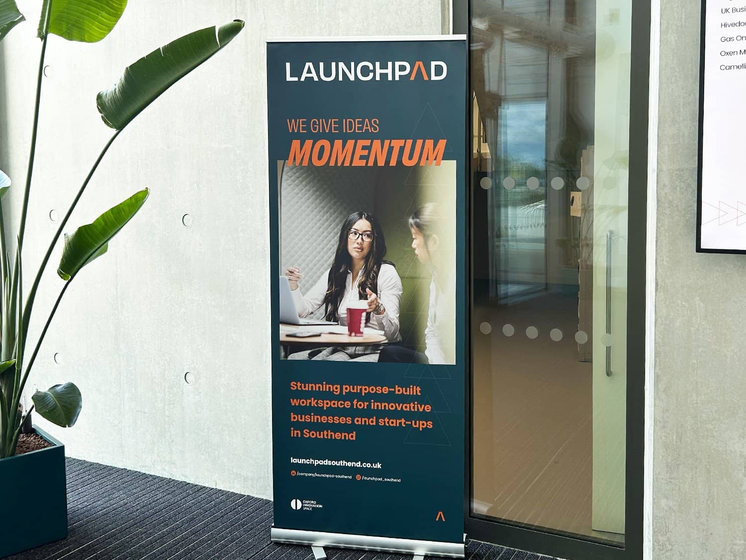 Innovative startup workspace at Launchpad with entrepreneurs and modern design.
