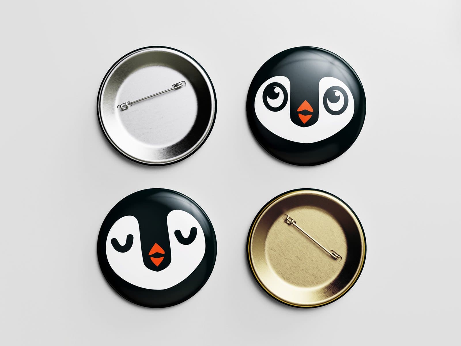 A sleek black and gold penguin-themed push pin set with a minimalist design.