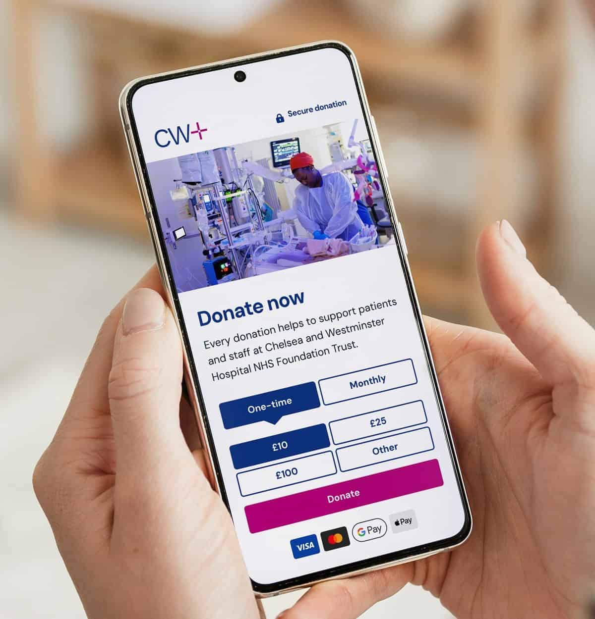 Mobile phone displaying a hospital donation webpage for NHS support.